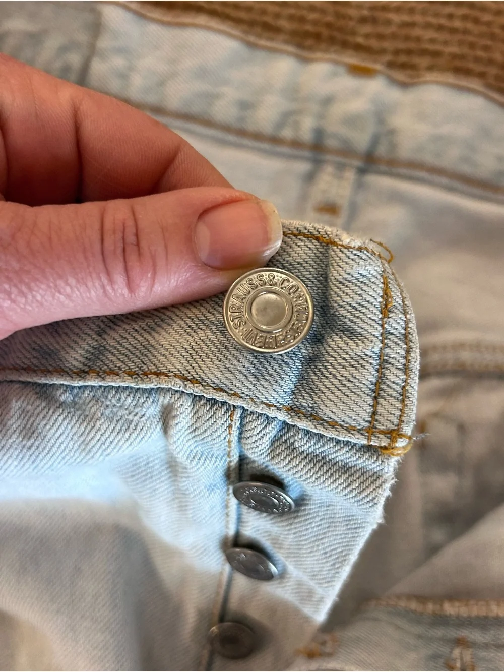 Vintage 1993 men's Levi's 501 light blue denim jeans with leather patch 38×34